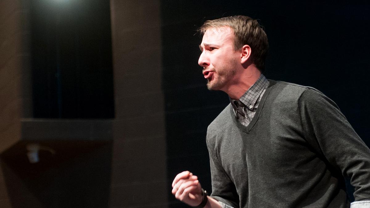 An actor performs on stage in the Hartung Theatre.